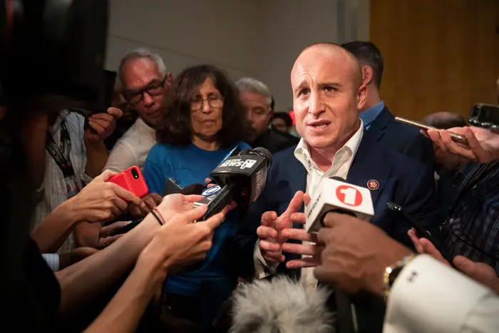 Max Rose surrounded by reporters in October, 2019.